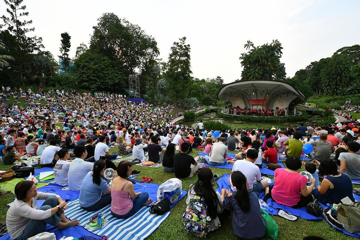 The packed lawn comprising more than 12,000 people enjoying a mix of classics and family favourites played by the Singapore Symphony Orchestra, led by associate conductor Joshua Tan. The pieces include Rossini's Overture To The Barber Of Seville, Sho
