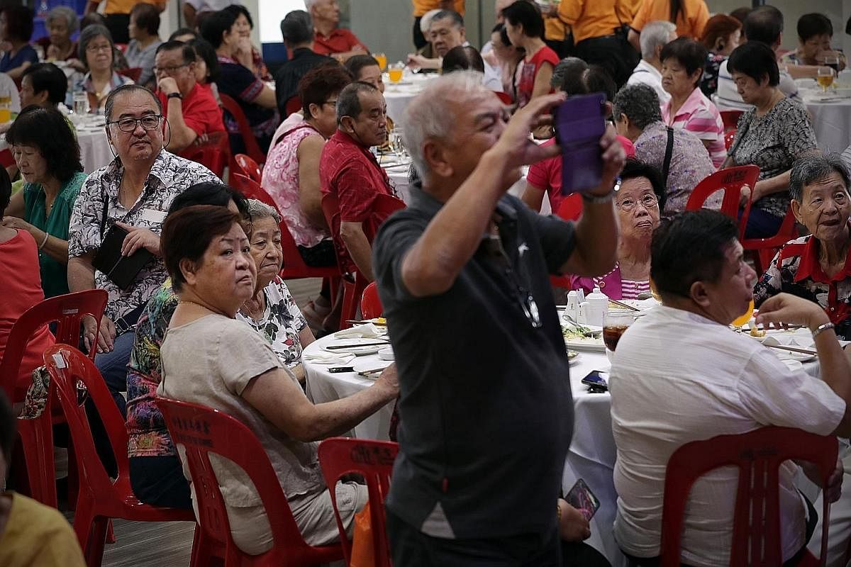 Residents of the community attending the Teck Ghee Wellness National Day Celebration Lunch where they watched a fashion show by the modelling interest group on stage on Aug 18.