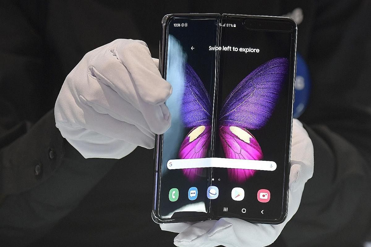 The Samsung Galaxy Fold (right), which costs $3,088 in Singapore, was sold out here on its first day of sale last Wednesday.