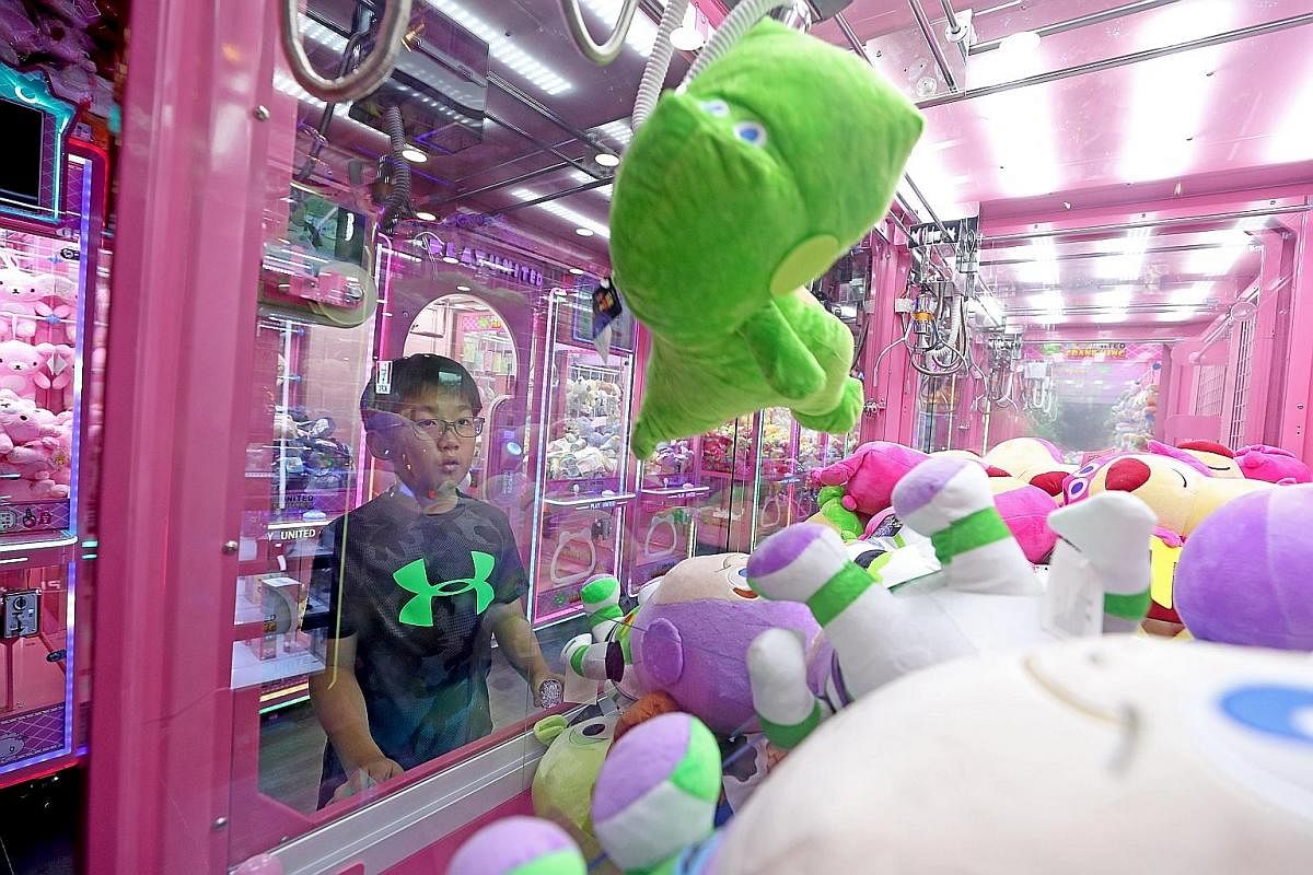 Primary 4 pupil Ewan Ong plays claw machines at least thrice a week and keeps more than 60 plushies, which he won, at home. 