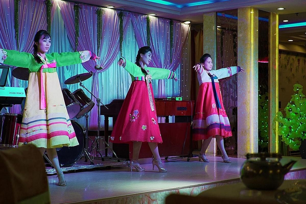 At Pyongyang Restaurant in Shenyang, North Korean waitresses double as performers. 