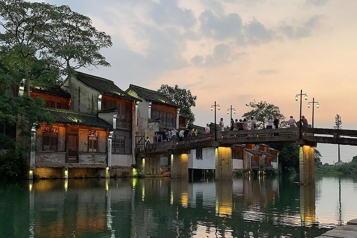 Step into Old China in Wuzhen, with its arched stone bridges and intricate canal systems.