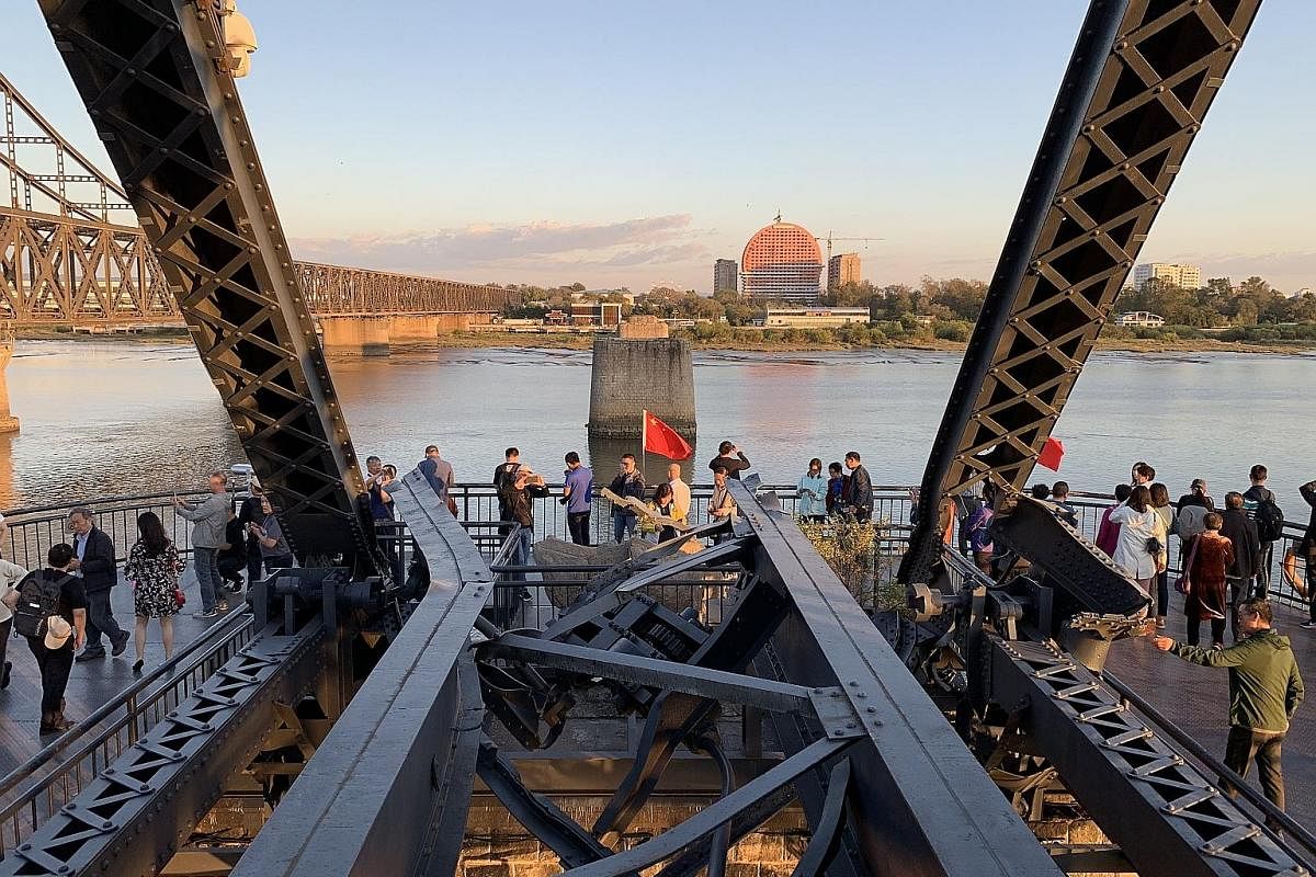 The Yalu River Broken Bridge in Dandong, bombed out during the US-Korean War, has been converted into a tourist destination.