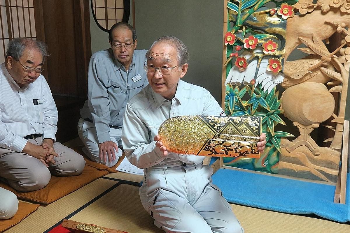 Top: The ninth-generation Tamaya Shobei, 65, with the handcrafted tools he uses to make and repair karakuri dolls. Mr Tamaya, born Shoji Takashina, began his apprenticeship at 25. Above: The skeleton of a karakuri puppet in Mr Tamaya's atelier. The k
