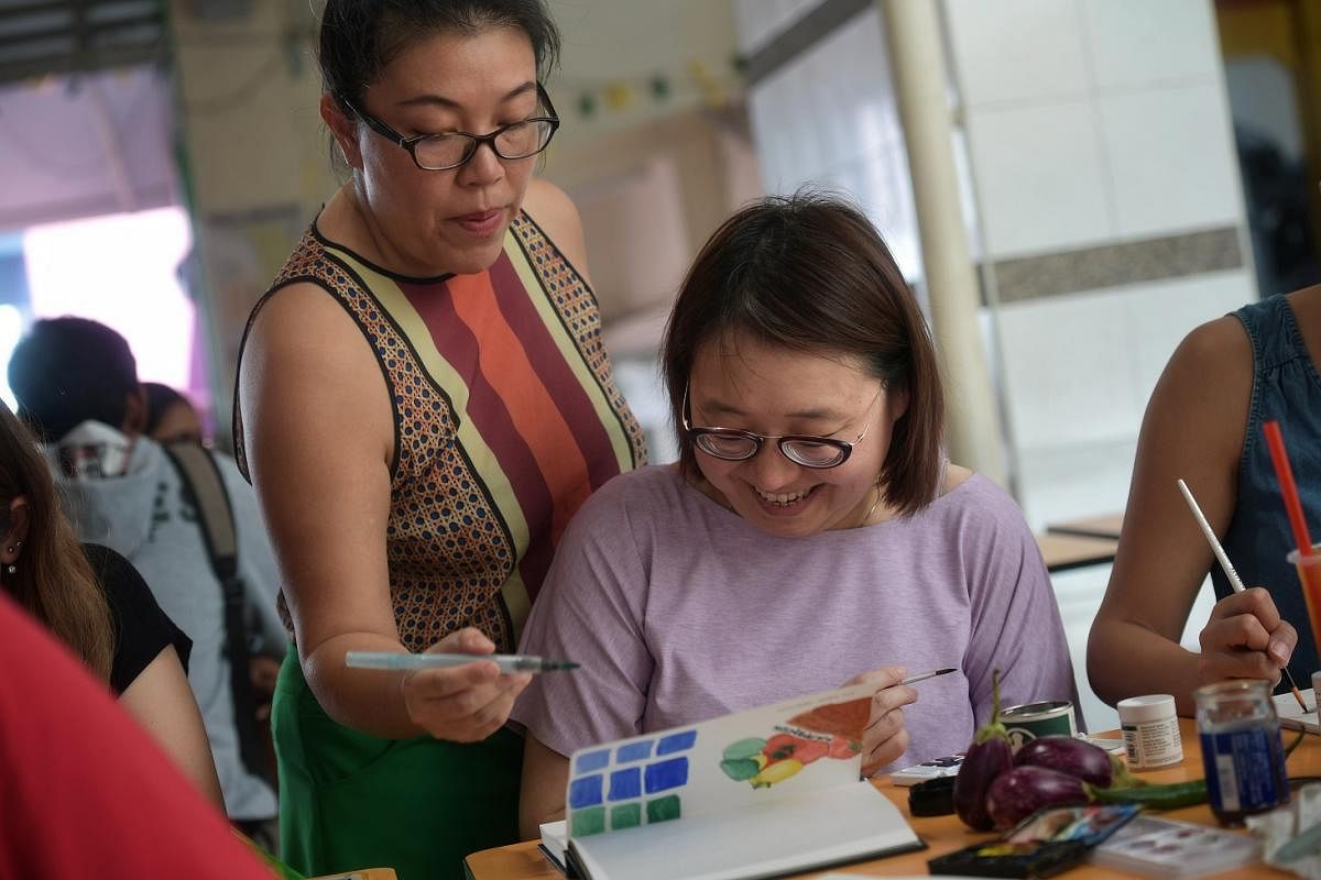 Senior culture correspondent Ong Sor Fern learning watercolour painting from Ms Susan Olij, a lecturer at Lasalle College of the Arts, as part of a SkillsFuturesubsidised course.