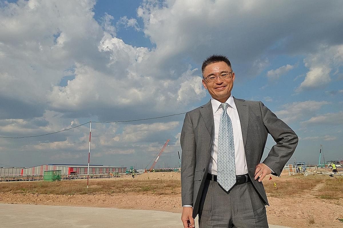JAPAN Mr Yoshihisa Tonozuka, managing director of Toyota Myanmar, at the construction site for Toyota's new factory in Thilawa SEZ, arguably Myanmar's most developed industrial park. Above: The Myanmar subsidiary of Singapore-listed agribusiness gian
