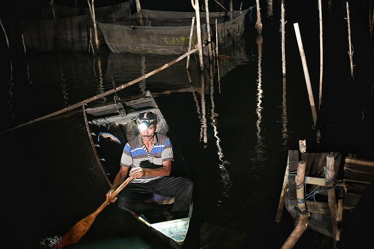 Right: A location believed to be an illegal mining pit in Samarinda, the provincial capital of East Kalimantan. Left: Fish breeder Marsulap returning from his fish farm in a mine lake that is now a source of income for his family. Far left: Miner Sug