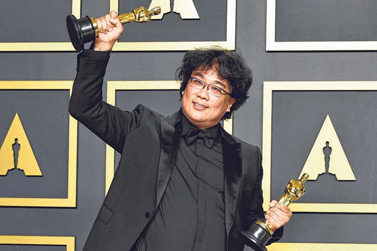 Director Bong Joon-ho with his Academy Awards for his film, Parasite, in Hollywood.