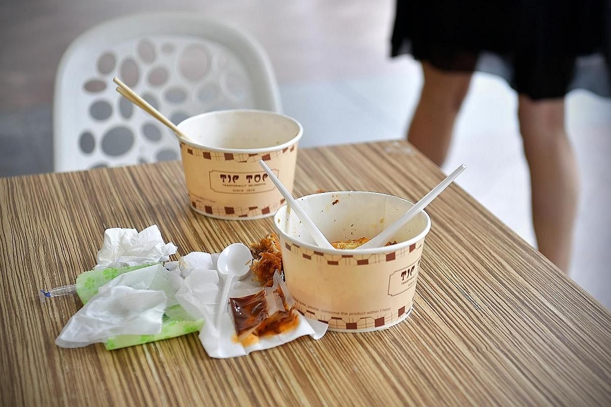 Diners queueing up to wash hands at Tiong Bahru Market before eating or after returning used crockery. ST PHOTO: CHONG JUN LIANG People are still leaving their used crockery, leftovers and used tissue paper behind for workers to clean up after them, 