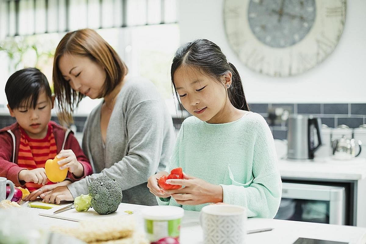When family members have to stay home together for long periods, parents should maintain the daily routines of children. But they should also set aside time to engage fully with the young ones, such as cooking together.