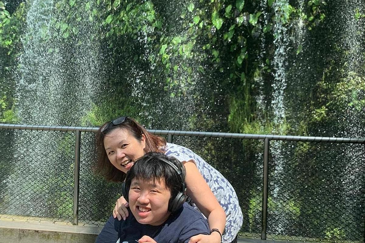 Amanda Khoo with her mum, who wants to be known only as Madam K. Ooi, at Changi Airport, one of her favourite places to visit, before the circuit breaker period started. The teenager has severe autism and wants to go outdoors, but refuses to wear a m