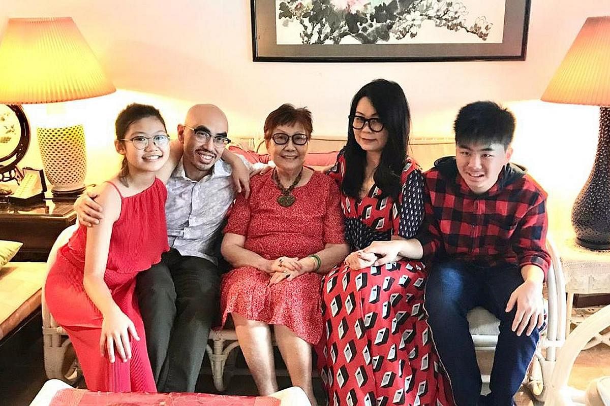 Mrs Florence Choy (next to her son Julian) says he has moderate autism and misses going to school, working out at the gym and having play dates with his friends - and sometimes has a meltdown. Ms Magdalene Ong has kept her son Chalmers Wong occupied 