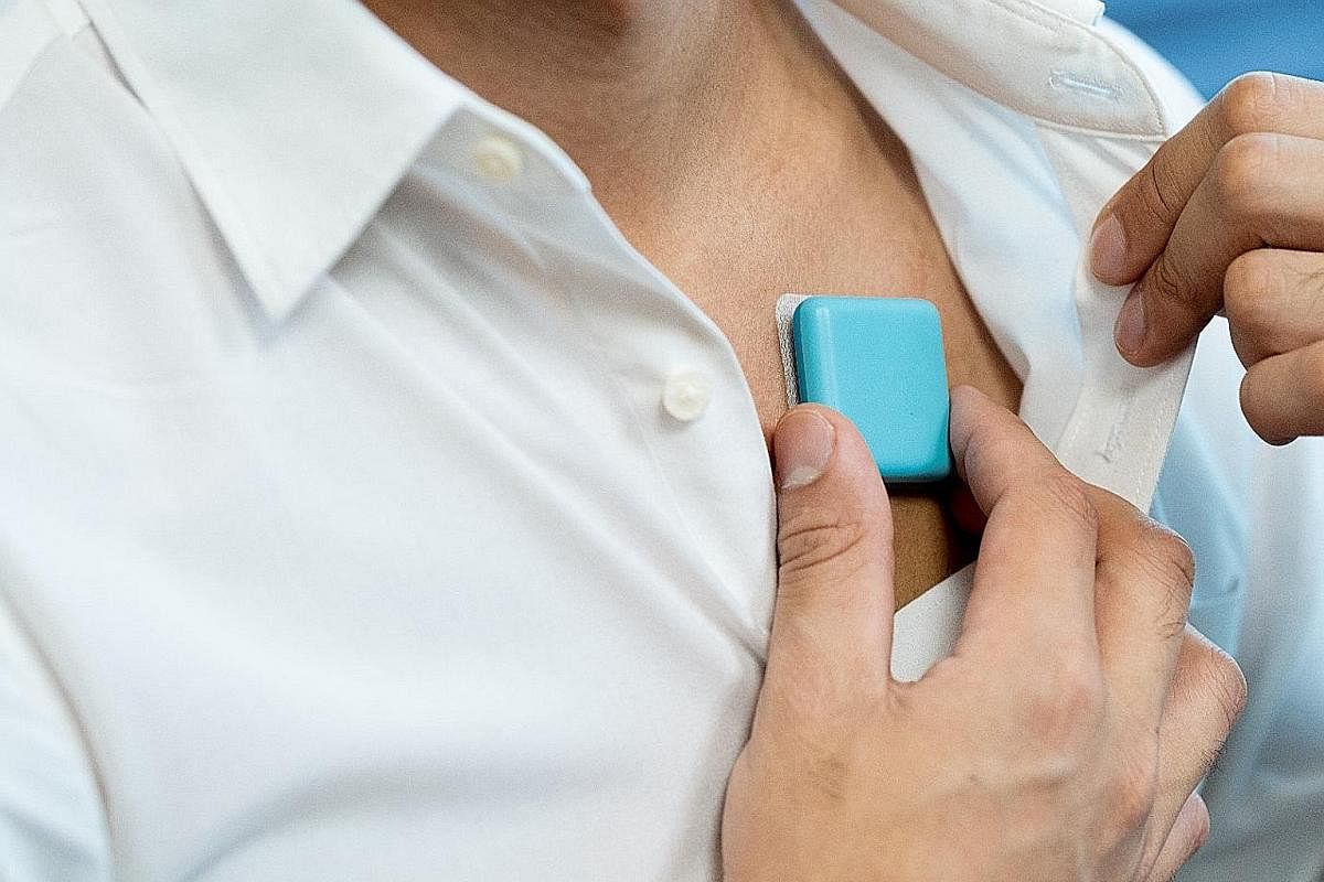 Home-grown medical start-up Respiree's wearables - one attached to the chest (left) and the other clipped over a finger - are on hospital trials to measure patients' vital parameters such as respiratory rate, breathing-pattern variability and pulse o
