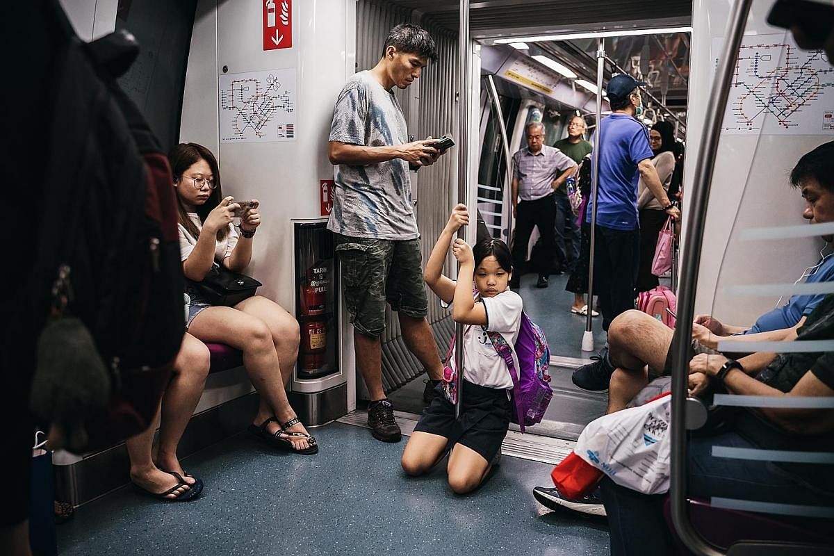 Right: Although both Yan Yun and her sister Yan Ling, 11, go home from school together, they tend to separate from each other on the bus or the train. For example, on a double-decker bus, one would sit on the upper deck while the other would sit on t