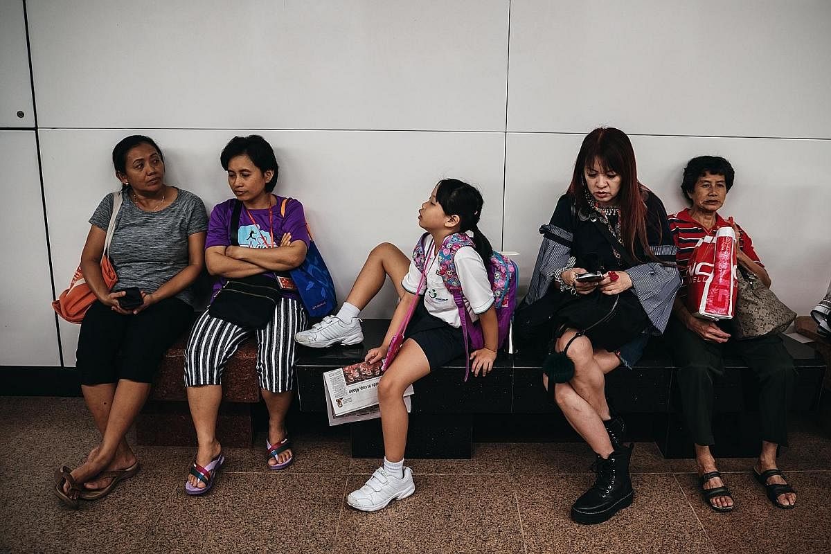 Right: Although both Yan Yun and her sister Yan Ling, 11, go home from school together, they tend to separate from each other on the bus or the train. For example, on a double-decker bus, one would sit on the upper deck while the other would sit on t