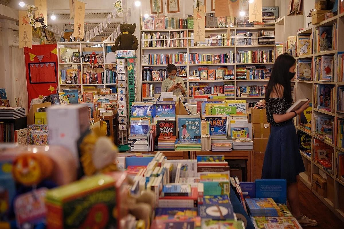Children's bookstore Woods In The Books (left) in Tiong Bahru was one of the bookstores caught off guard by the circuit breaker. As it had no webstore then, it decided to curate care packs of books and toys to send to customers.