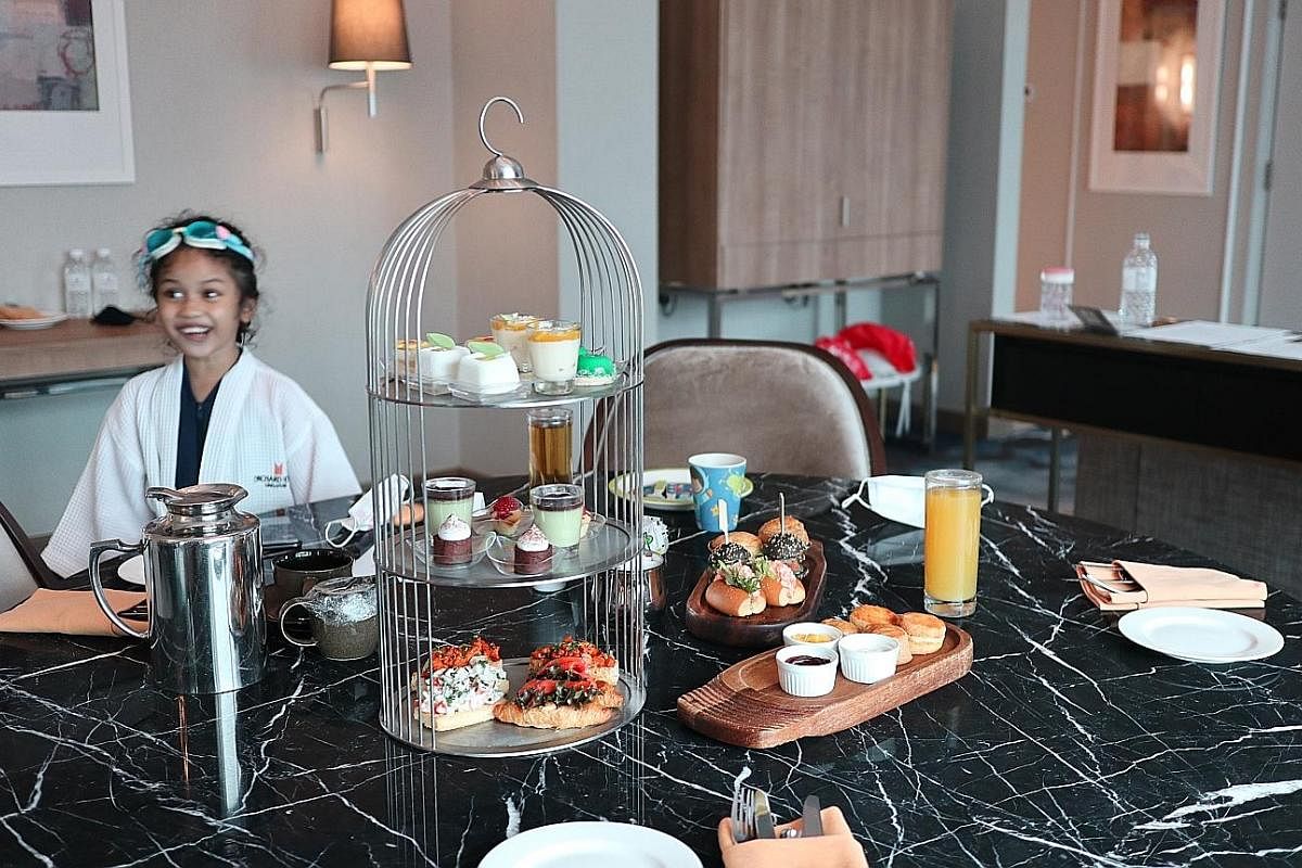 Be pampered with a high tea spread (above left) served in your suite at Orchard Hotel and a yacht trip (top) that takes you around the Southern Islands, including Lazarus Island (above right) where the waters are crystal-clear.