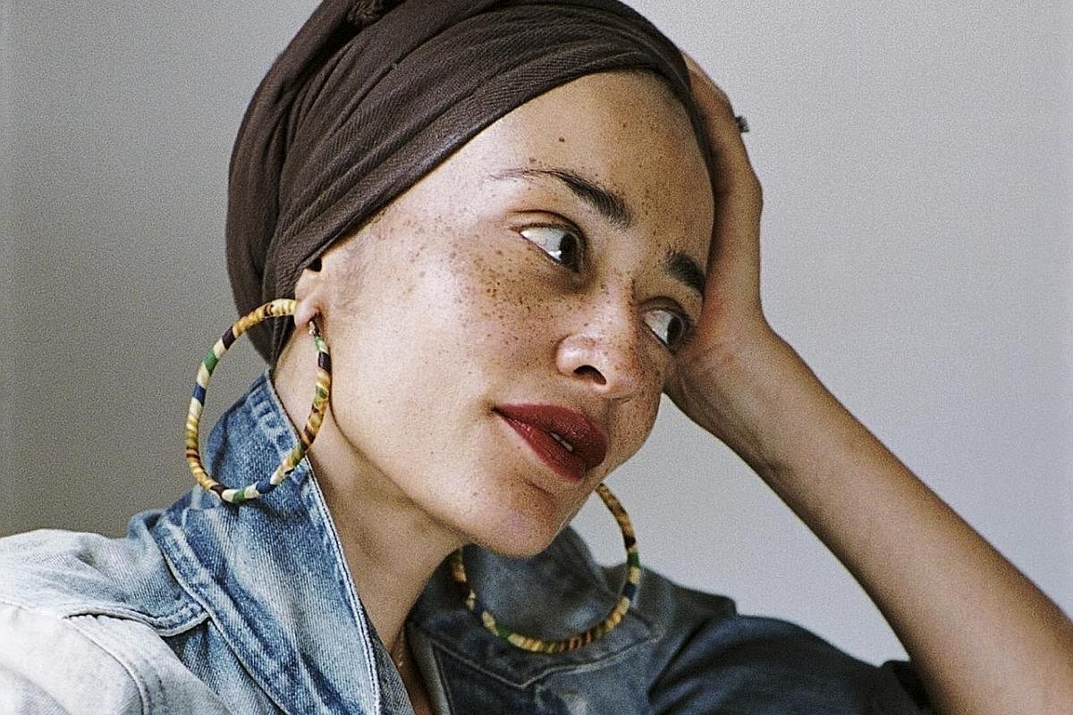 British writer Zadie Smith, a headliner at the Singapore Writers Festival, has been dealing with the unbearable present by escaping to the past - by means of the historical novel she is writing.