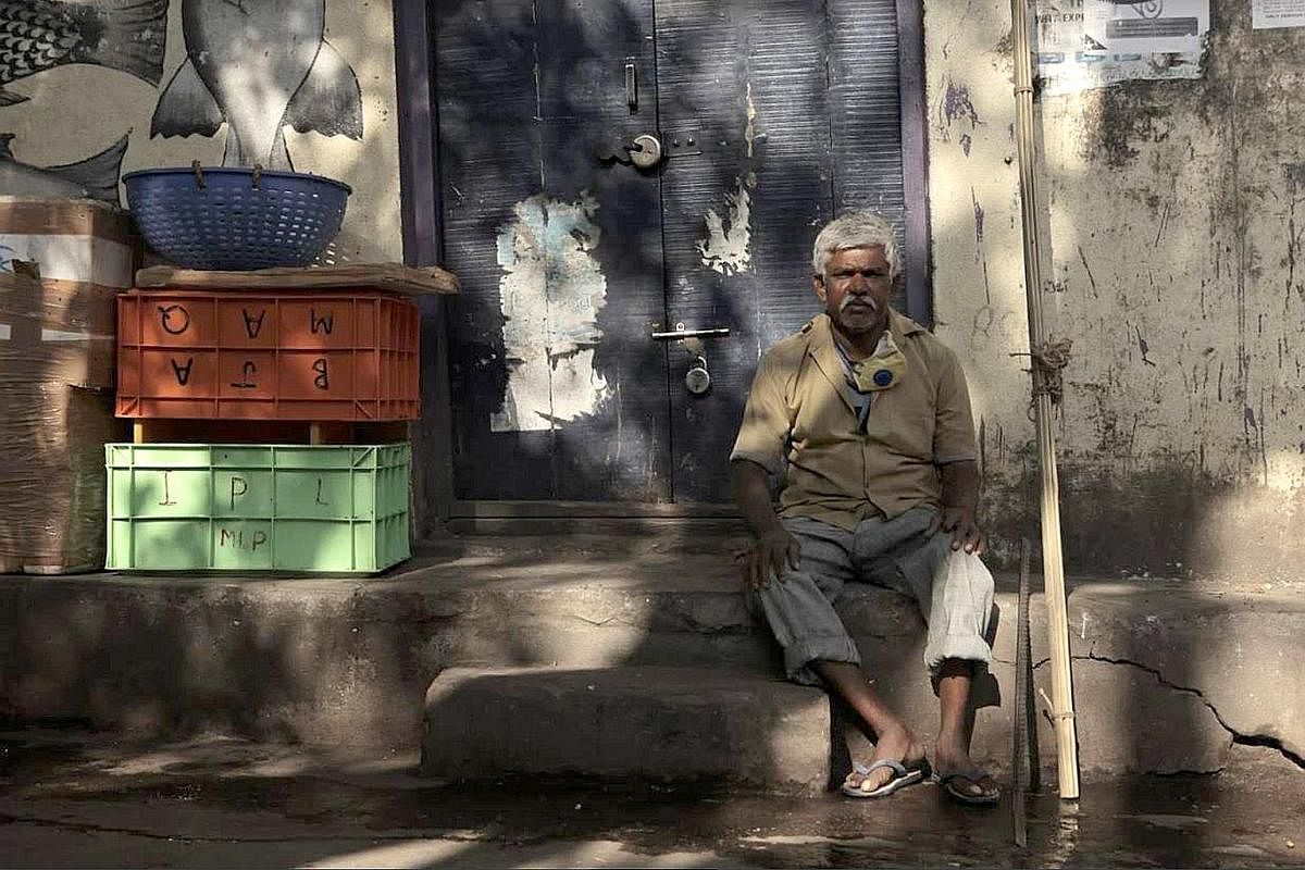 ABOVE: Mr Pedanna G, 55, waiting for work at his usual place near the fish market of a middle-class neighbourhood in south Bangalore. He is what is known in India as a manual scavenger, someone who cleans toilets, drains and manholes by hand. RIGHT: 