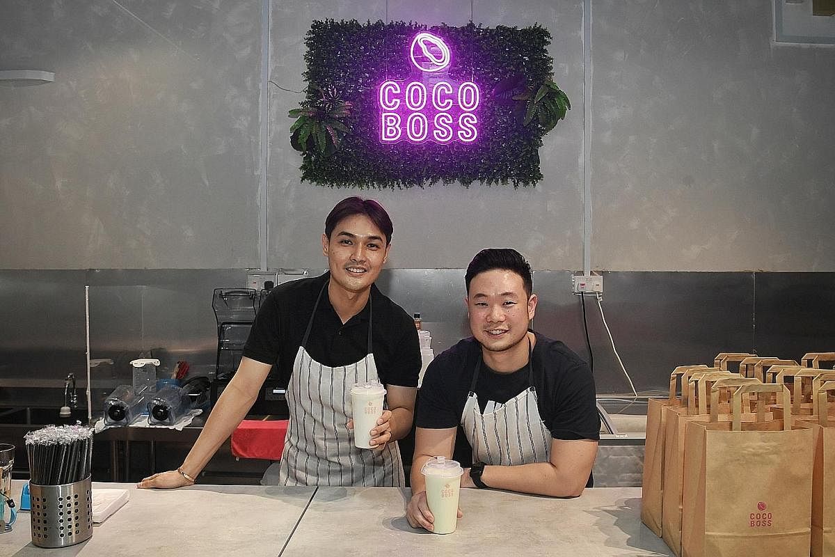 Mr Benjamin Liu (far left) and Mr Leo Tan of CocoBoss in Space @ Kovan are focusing on deliveries. Mr Tan Yong Xi and his wife Valencia Tan, owners of CocoCane, are looking to add new fruit flavours and possibly acai to its line-up. Mr Reo Yau, co-fo