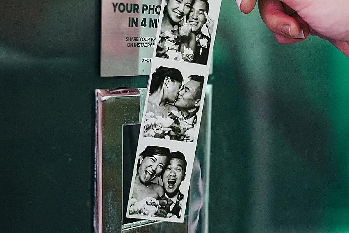 Ms Thea Tan and Mr Afiq Safwan Adly (both right) brought in a discarded analogue photo booth from San Diego last year and now lease it out at The Projector. Novelty meets nostalgia with these black-and-white photos taken at Fotoautomat's vintage anal