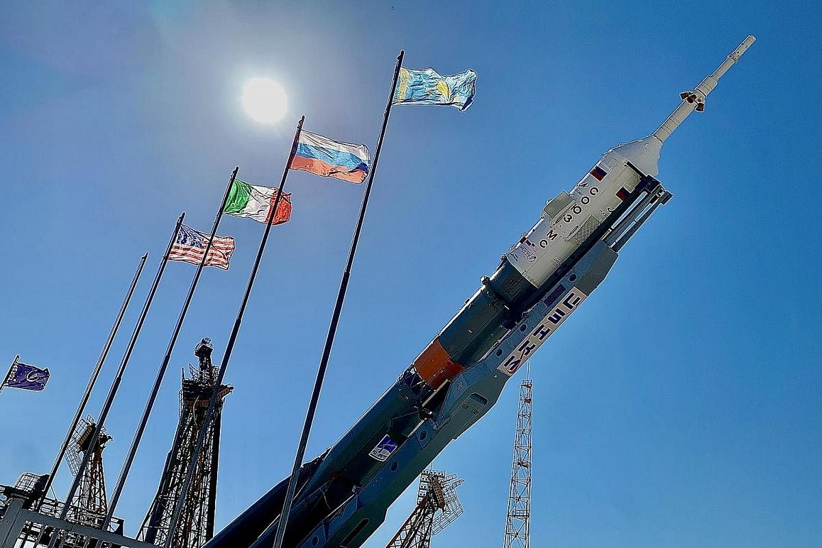 The MS-13 Soyuz rocket is hydraulically coaxed upright at the launchpad. Cosmonauts (from left) Andrew Morgan, Aleksandr Skvortsov and Luca Parmitano made up the crew for the flight to the International Space Station. The MS-13 Soyuz rocket, lying on